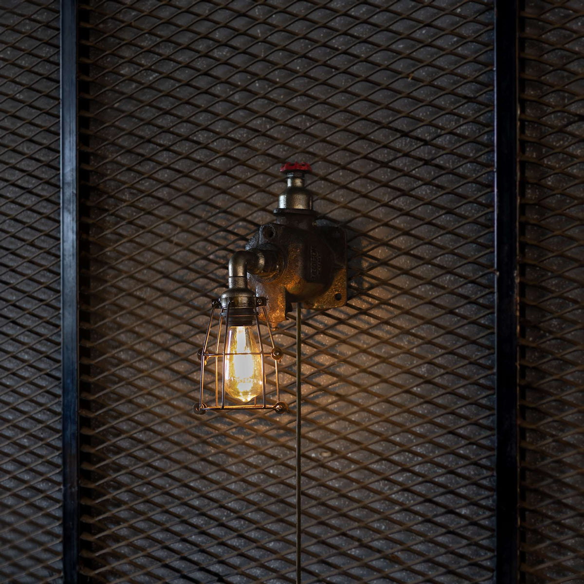 Ember industrial wall lamp handmade from reclaimed ship pipes